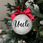 Uncle round Christmas KS Creations bauble filled with feathers and black font