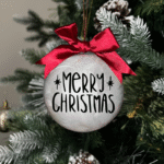 Merry Christmas round Christmas KS Creations bauble filled with feathers and black font
