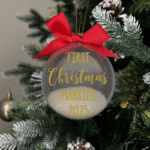 First Christmas Married 2025 round Christmas KS Creations bauble filled with snow and gold font