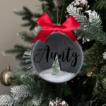 Aunty round Christmas KS Creations bauble filled with snow and tree and black font