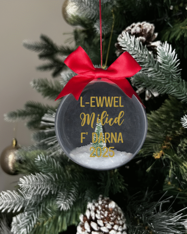 tree gold L ewwel milied f' darna 2025 round Christmas KS Creations bauble filled with snow and tree and gold font